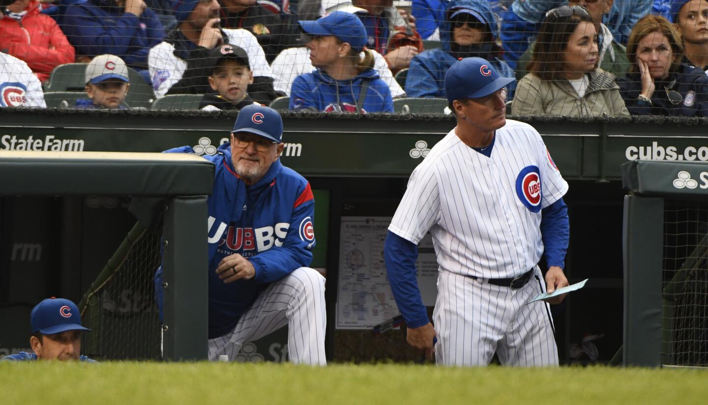 Cubs manager Joe Maddon, left, and pitching coach Jim Hickey look on during the sixth inning of a game against the Cardinals at Wrigley Field on Sunday, Sept. 30, 2018.
