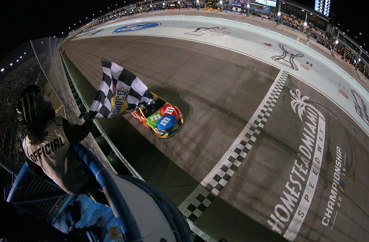 Kyle Busch crosses the finish line to win Sunday's NASCAR Cup race at Homestead Speedway.