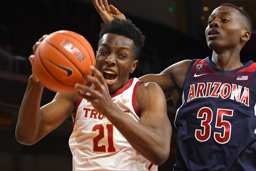 LOS ANGELES, CA - FEBRUARY 27: Onyeka Okongwu #21 of the USC Trojans grabs a rebound in front of Christian Koloko #35 of the Arizona Wildcats in the first half of the game at Galen Center on February 27, 2020 in Los Angeles, California. (Photo by Jayne Kamin-Oncea/Getty Images) ** OUTS - ELSENT, FPG, CM - OUTS * NM, PH, VA if sourced by CT, LA or MoD **