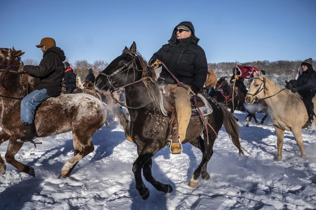 Horseback riders.