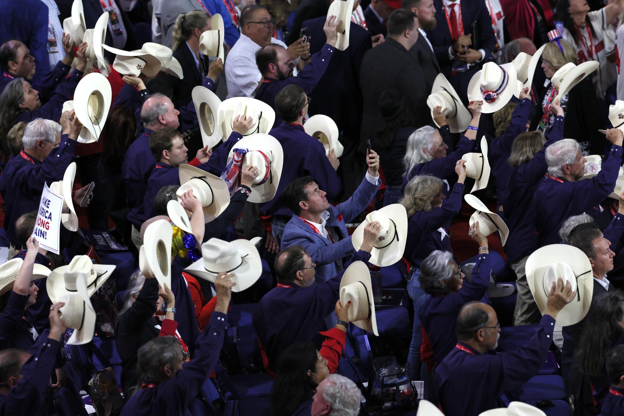 Delegates raise their cowboy hats during the Republican National Convention.