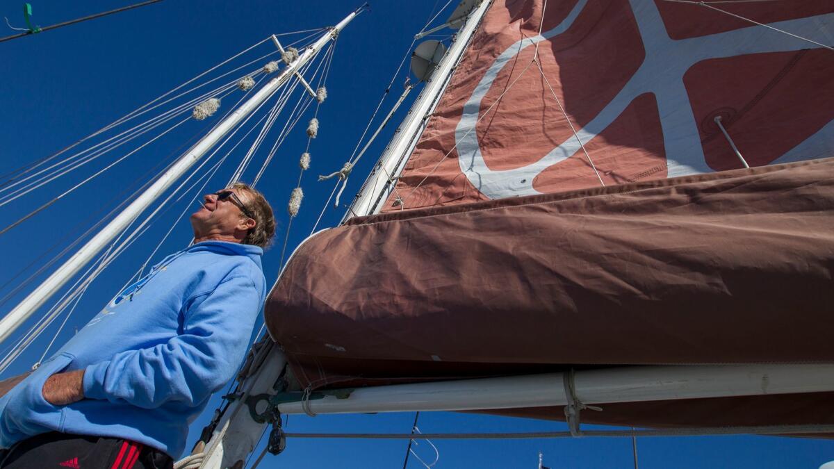 Wil Van Natta, skipper of the Golden Rule, looks out over the bay in Newport Beach on Friday.