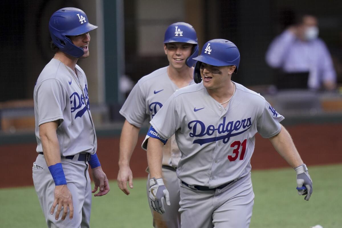 Joc Pederson, front, celebrates a three-run home run during the first inning of Game 3 of the NLCS.