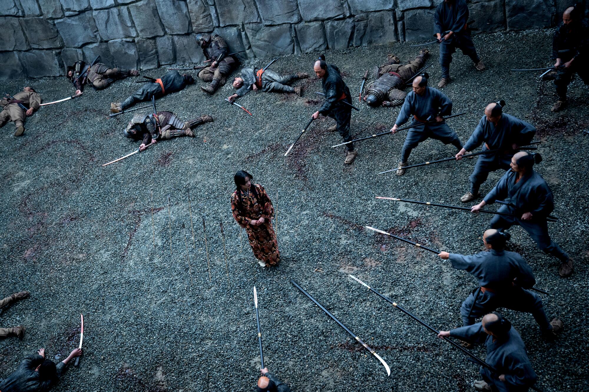 Lady Mariko is encircled by guards pointing spears at her in “Shōgun.”