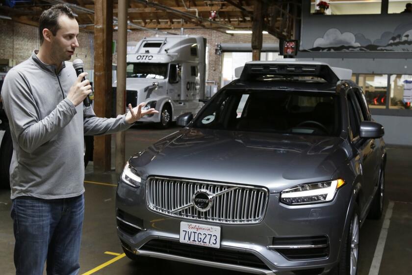 FILE - In this Dec. 13, 2016, file photo, Anthony Levandowski, head of Uber's self-driving program, speaks about their driverless car in San Francisco. Uber has followed through on threats to fire Levandowski, a star autonomous car researcher whose hiring touched off a bitter legal fight with Waymo, the former self-driving car arm of Google. Waymo has alleged that Levandowski downloaded 14,000 documents containing trade secrets before he founded a startup that was purchased by Uber. (AP Photo/Eric Risberg, File)