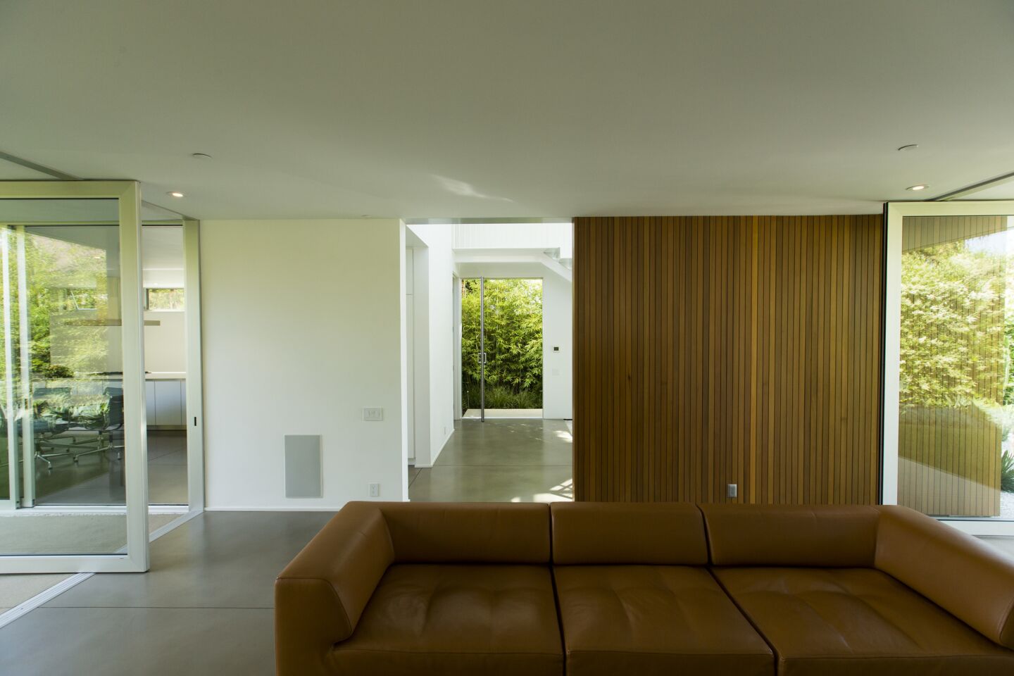 The living room area of the Midcentury Modern home designed by Woods + Dangaran.