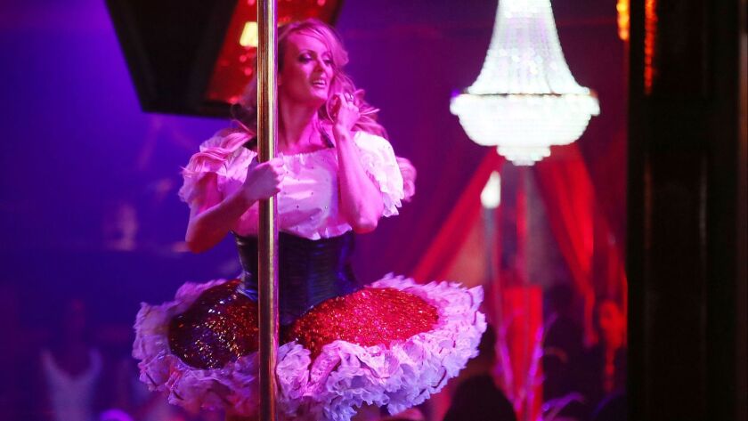 Stephanie Clifford, who uses the stage name Stormy Daniels, performs at the Solid Gold Fort Lauderdale strip club on March 9, 2018 in Pompano Beach, Florida.