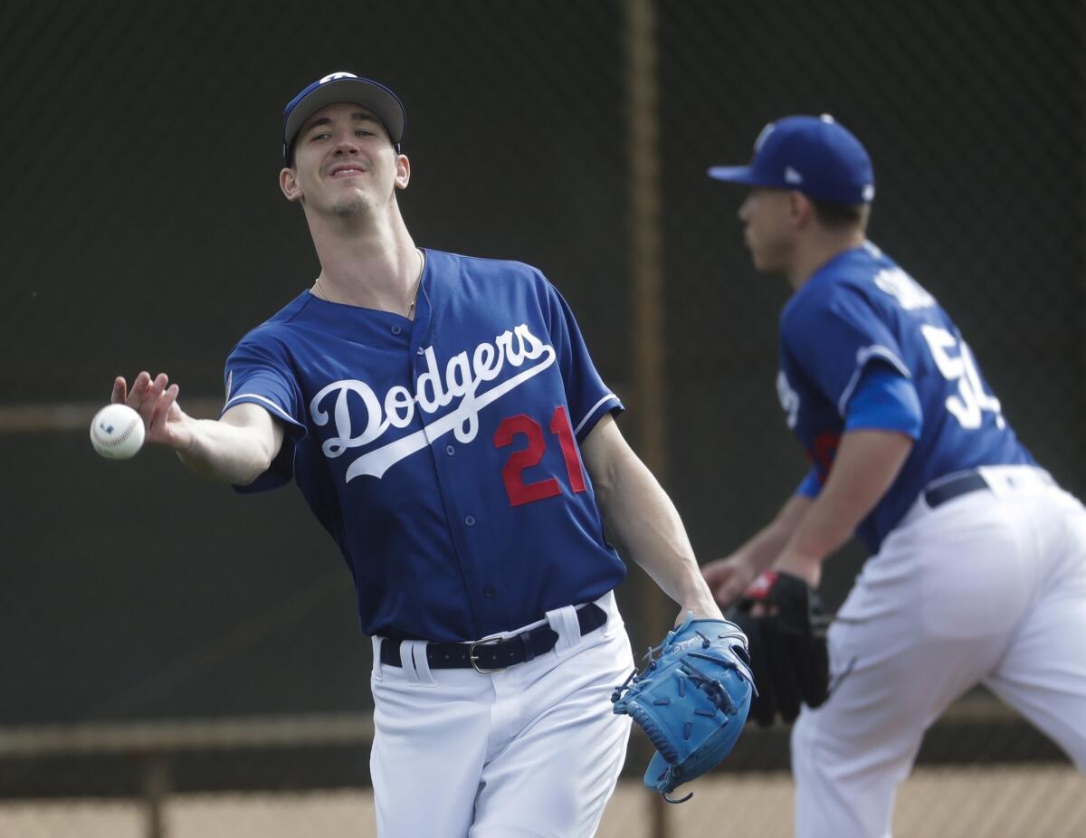 Walker Buehler runs a drill during a spring training workout on Feb. 13.