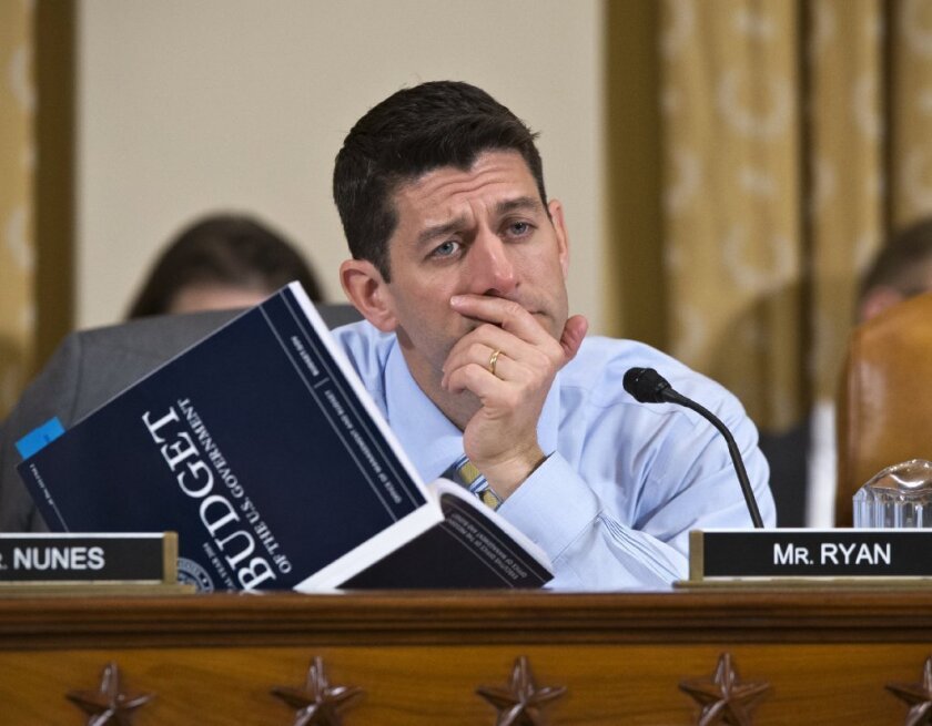 Rep. Paul D. Ryan ponders the federal budget.