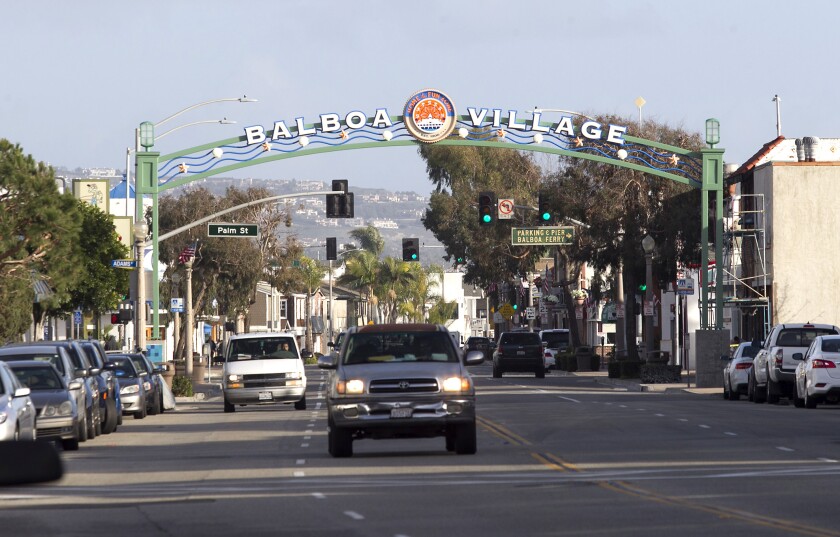 Newport Beach's Balboa Village area is marked by an arch across the roadway.