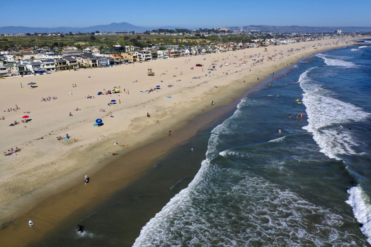 An aerial view of beachgoers on Saturday in Newport Beach.