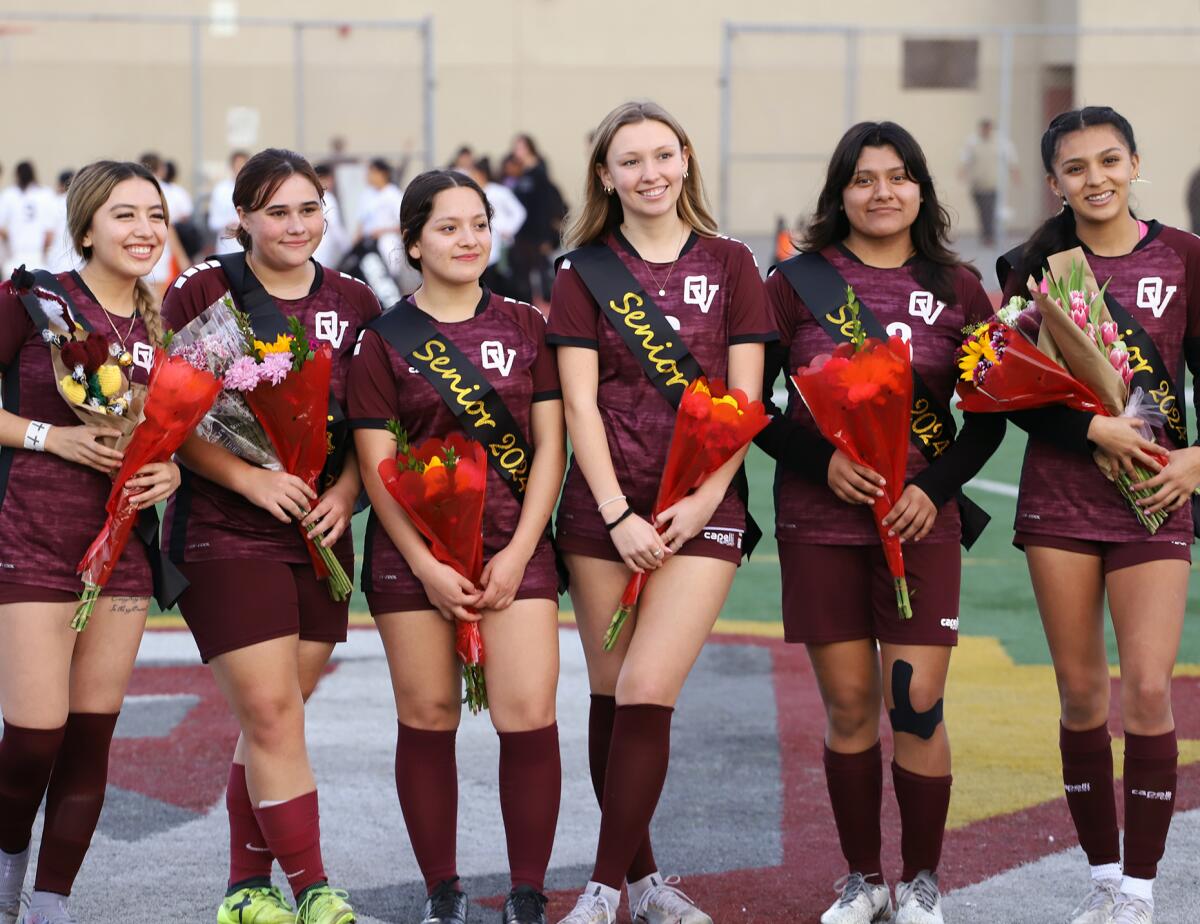 Seniors from the Ocean View High School girls' soccer team celebrate senior night before