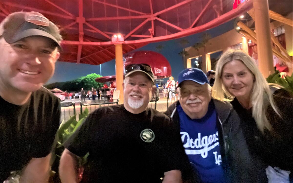 Richard Koehler with sons Todd and Tobin and daughter Kerrie Conti at Angel Stadium.