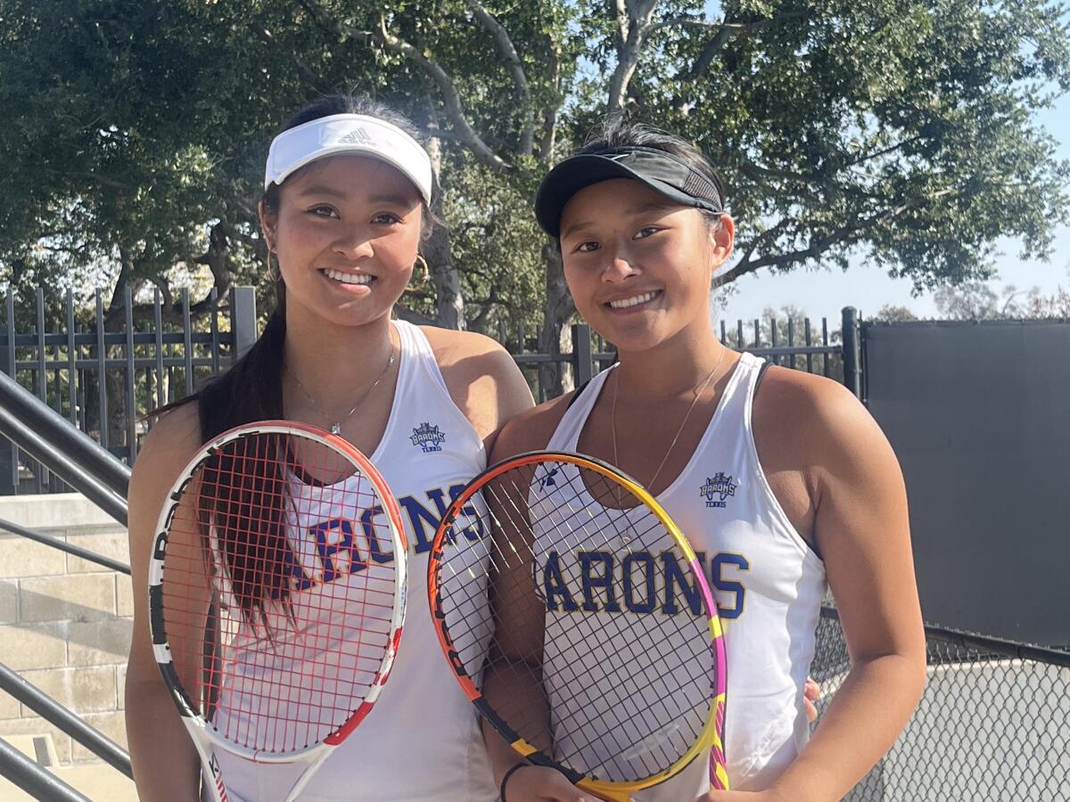 Katelyn Nguyen and Kendra Ly, from left, of Fountain Valley High girls' tennis.
