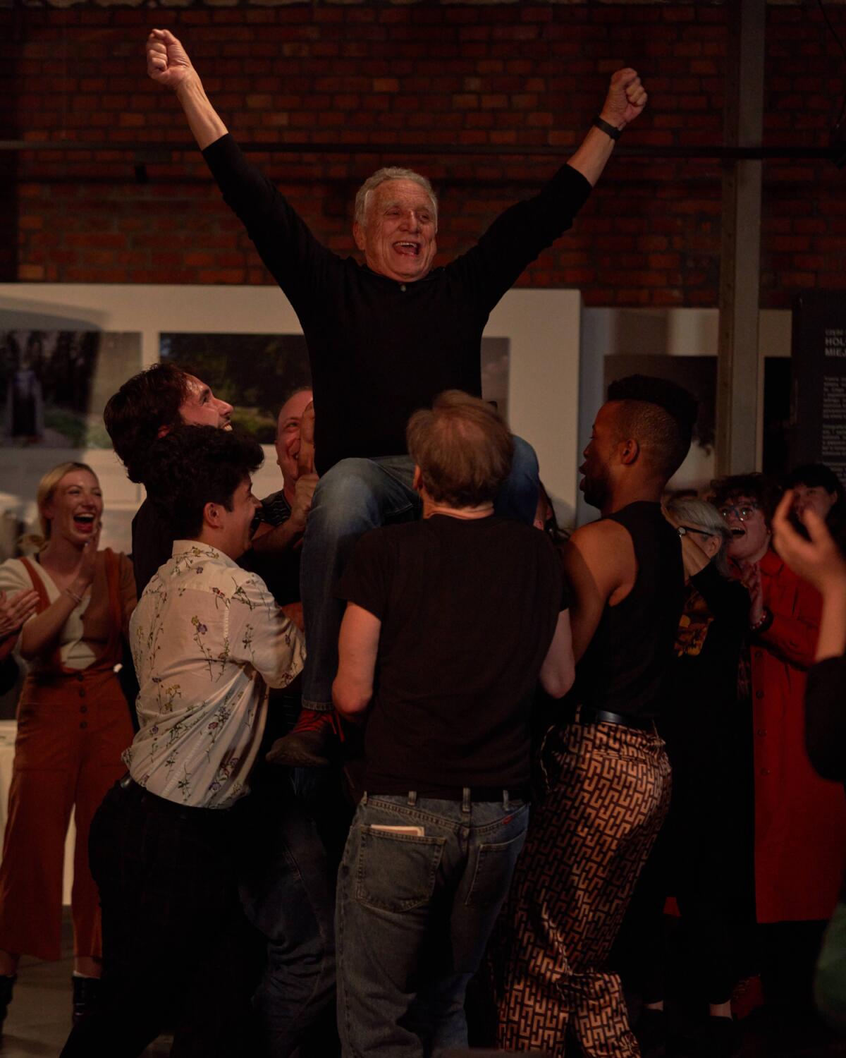 Moses Libitzky dances with students during filming of "The Assembly" in Krakow, Poland.