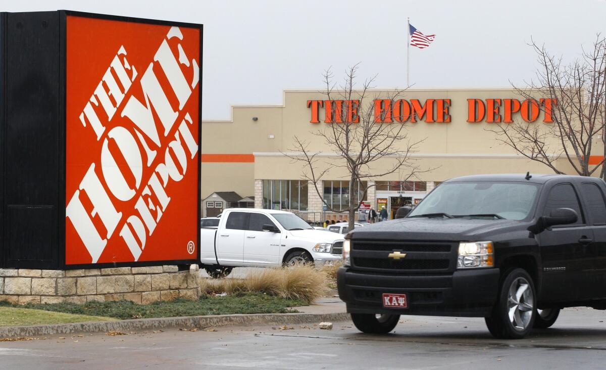The housing recovery has lifted Home Depot's earnings once again. The retailer reported Tuesday net income rose 43% to $1.35 billion in the third quarter. Above, a store in Oklahoma City in 2011.