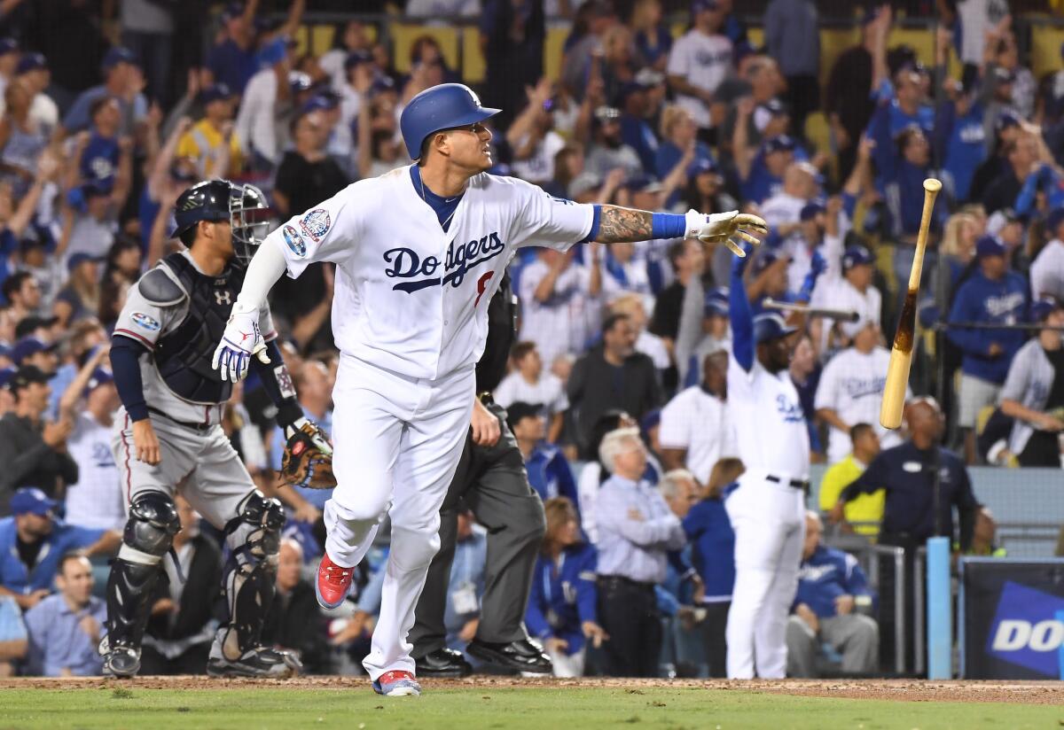 Manny Machado heads to first after hitting a home run for the Dodgers in the 2018 playoffs.