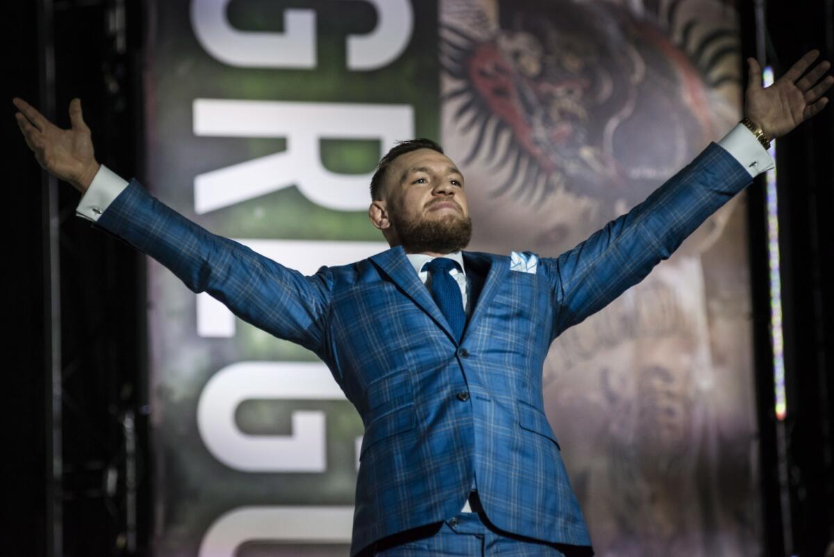 Conor McGregor gestures to the crowd during a promotional stop with Floyd Mayweather in Toronto on Wednesday, July 12, 2017, for their upcoming boxing match in Las Vegas.
