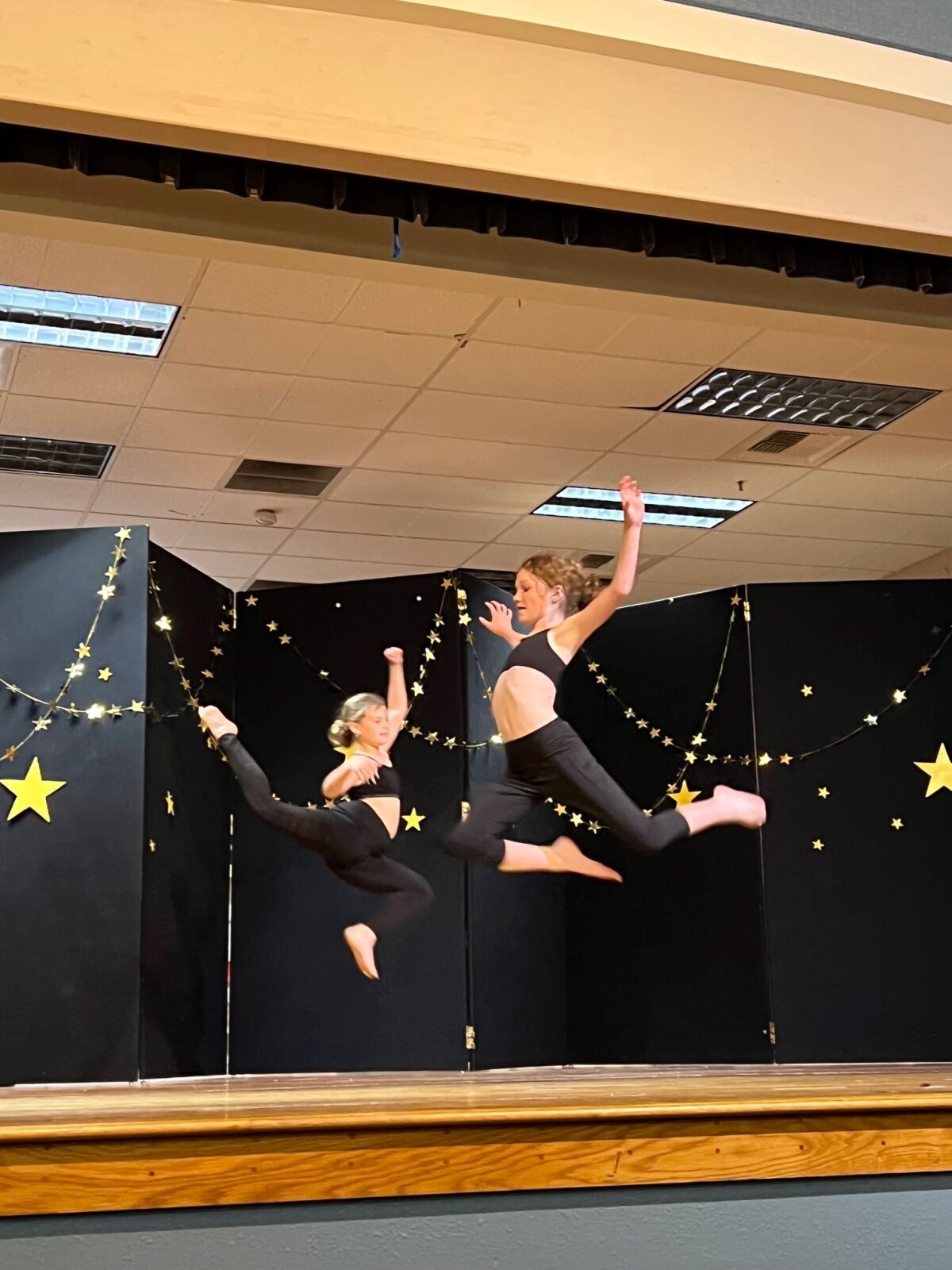 Maya Almog, left, and Bianca Grunvald perform at the Sage Canyon School talent show.