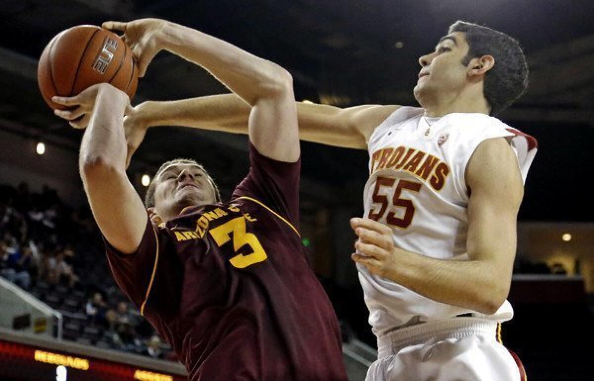 Arizona State center Eric Jacobsen is fouled by USC center Omar Oraby on a shot in the first half Saturday.