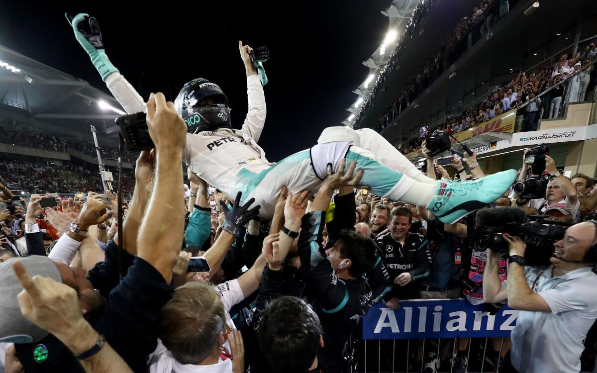 Nico Rosberg celebrates with his team after finishing second and securing the F1 World Drivers Championship during the Abu Dhabi Formula One Grand Prix on Nov. 27.