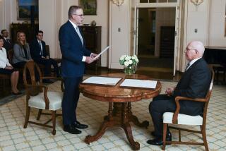 Anthony Albanese is sworn in as Australia's Prime Minister by Australian Governor-General David Hurley, right, during a ceremony at Government House in Canberra, Monday, May 23, 2022. Albanese has been sworn in ahead of a Tokyo summit while vote counting continues to decide whether he will control a majority in a Parliament that is demanding tougher action on climate change. (Lukas Coch/AAP Image via AP)