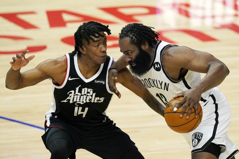 Brooklyn Nets guard James Harden drives past Clippers guard Terance Mann.