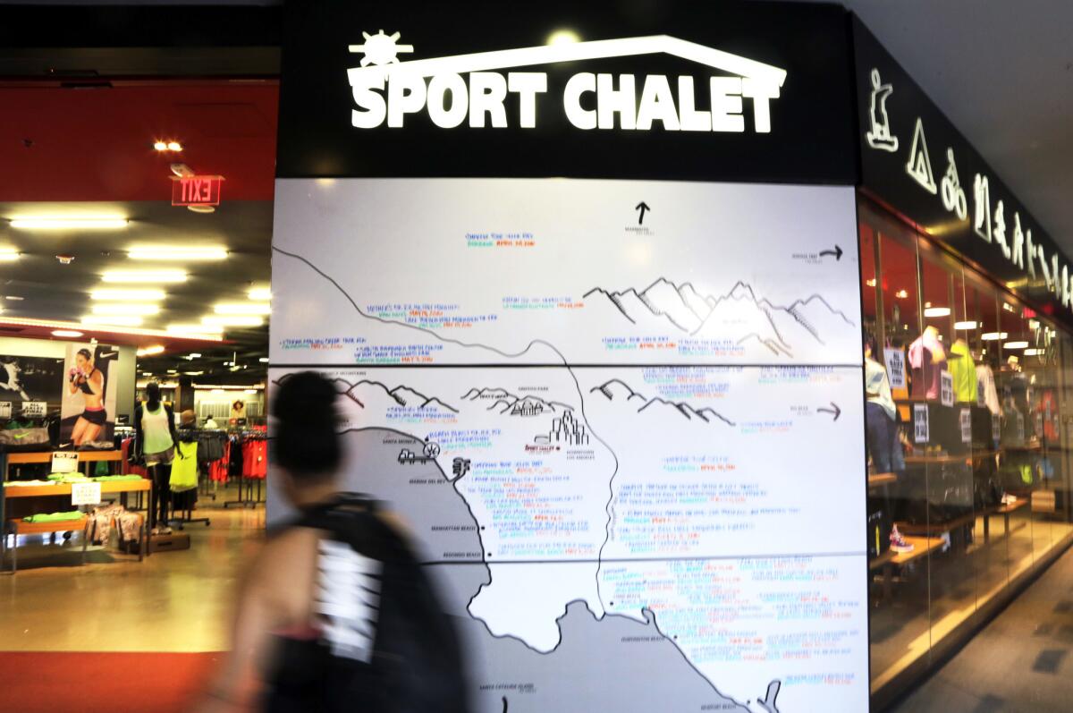A map listing Southern California recreational opportunities is seen outside a Sport Chalet store in downtown Los Angeles on April 16.