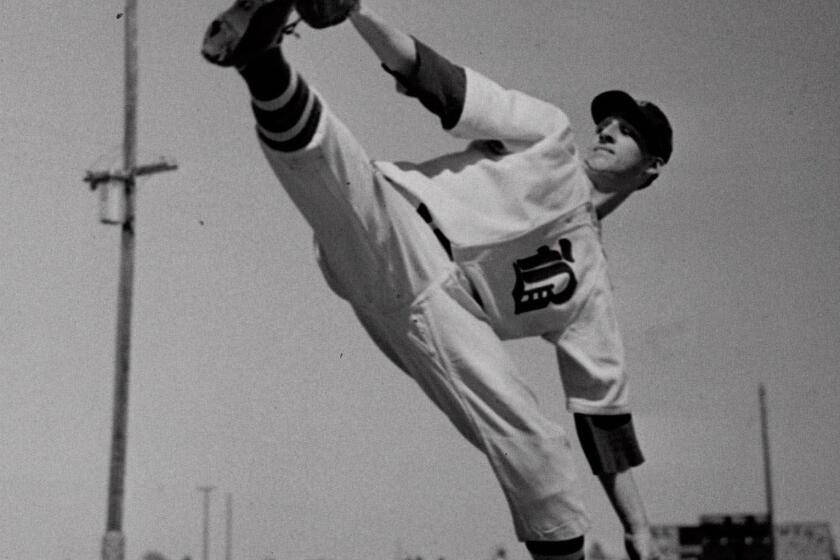 Warren Spahn tries out for the Boston Braves at a winter camp in Florida in 1942.