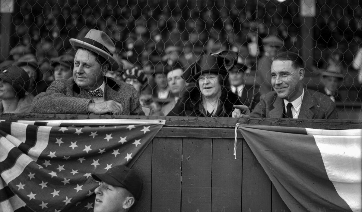 April 7, 1925 Los Angeles Angels owner William Wrigley Jr., left, and wife Ada attend the season opener at Washington Park. At right is David M. Renton, vice president of the Santa Catalina Island Co.
