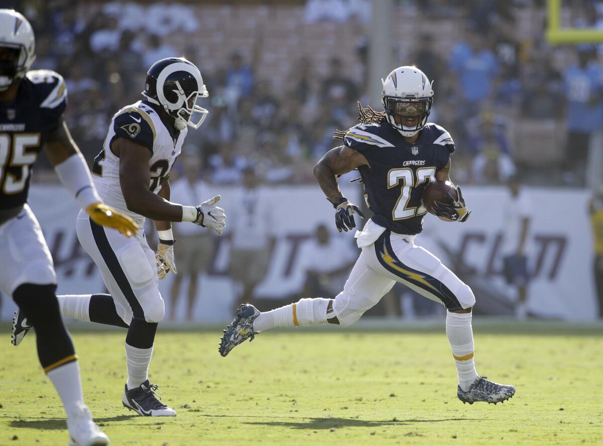 Los Angeles Chargers cornerback Jason Verrett runs after an interception during the first half of a preseason NFL football game against the Los Angeles Rams in Los Angeles. Verrett has torn his Achilles tendon during a conditioning test before the start of training camp. The former Pro Bowl defensive back was attempting to return to the Chargers after missing most of the last two seasons with knee injuries.