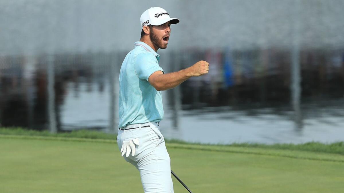 Matthew Wolff celebrates after making an eagle putt on the 18th green to win the 3M Open at TPC Twin Cities in Blaine, Minn., on Sunday.