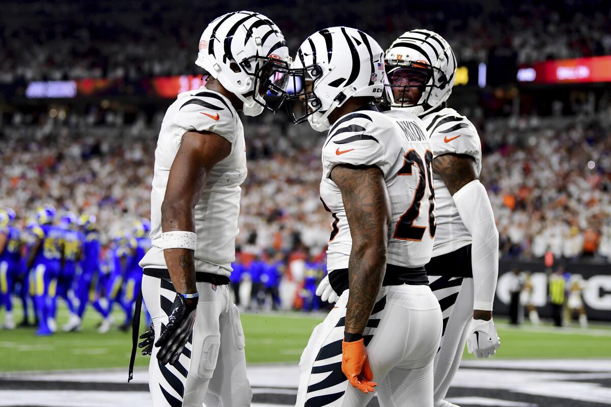 Cincinnati Bengals running back Joe Mixon celebrates his touchdown with wide receivers Ja'Marr Chase and Tee Higgins.