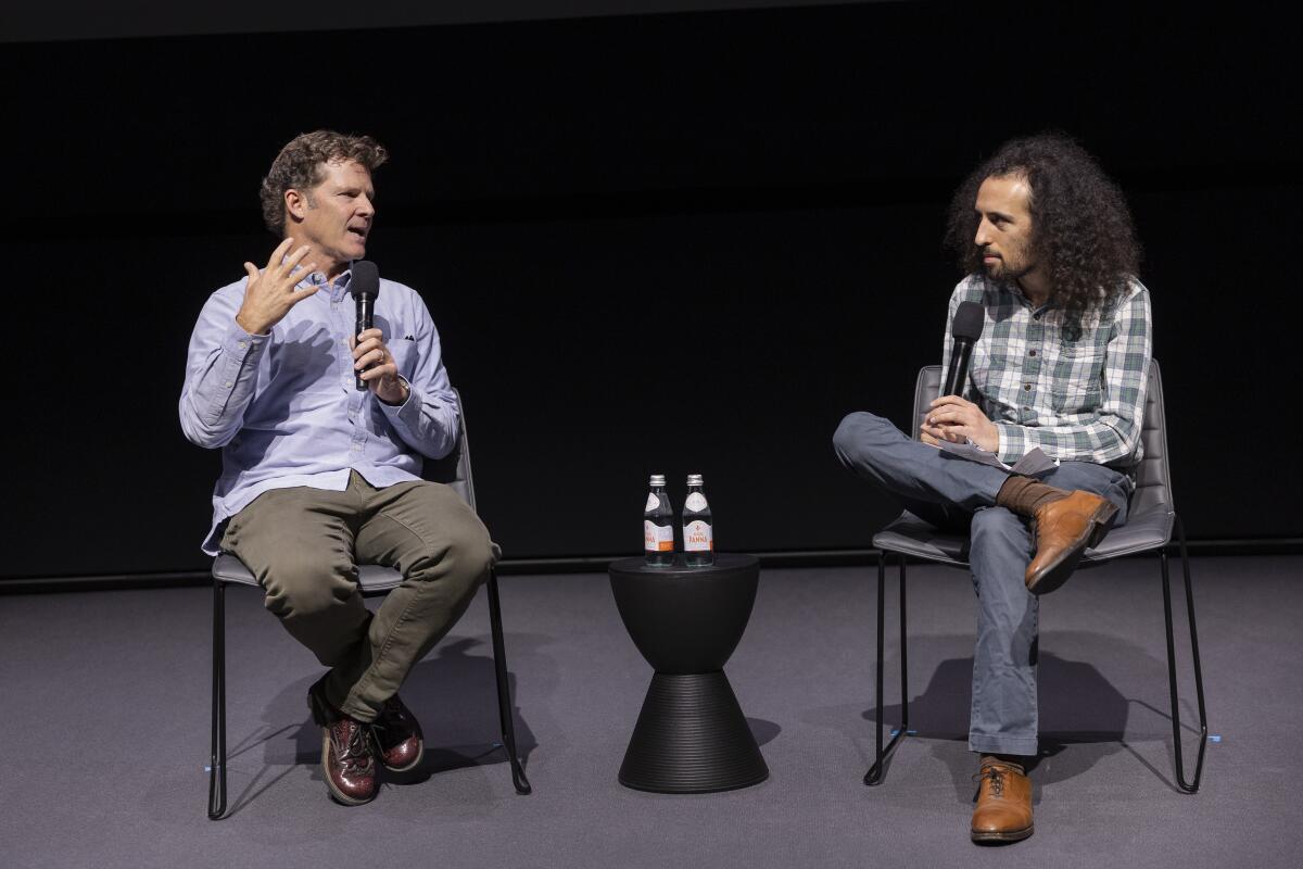 Climate columnist Sammy Roth, right, in conversation with Chad Nelsen, chief executive of the Surfrider Foundation.