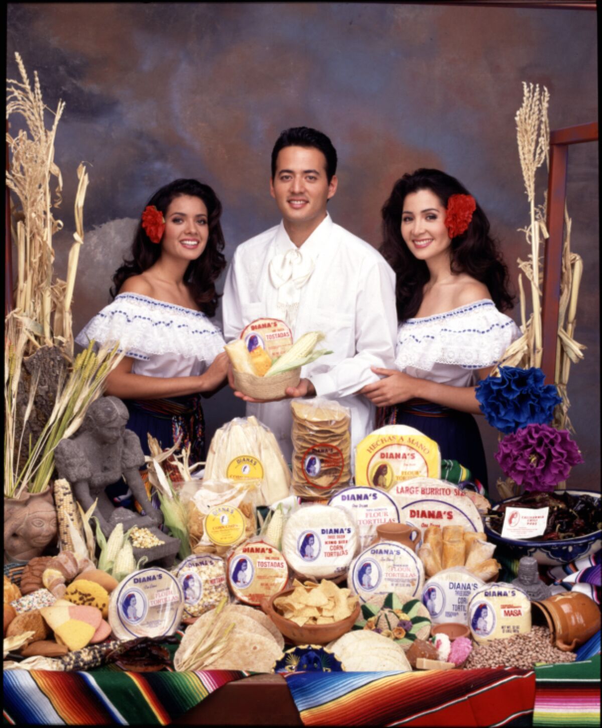 Tensha, Sam Jr. and Diana Magaña appear in a 1994 publicity photo for Diana's Mexican Food Products.