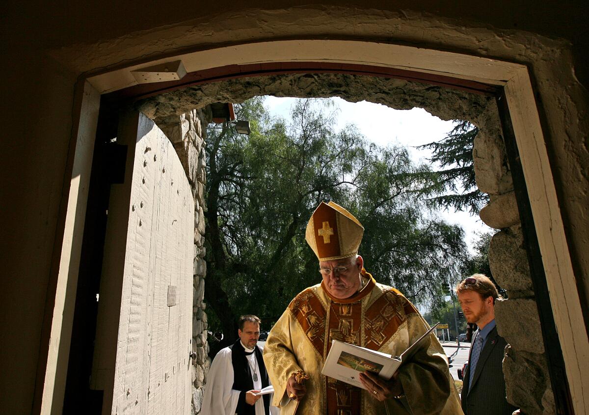 Bishop J. Jon Bruno enters a church in 2009.