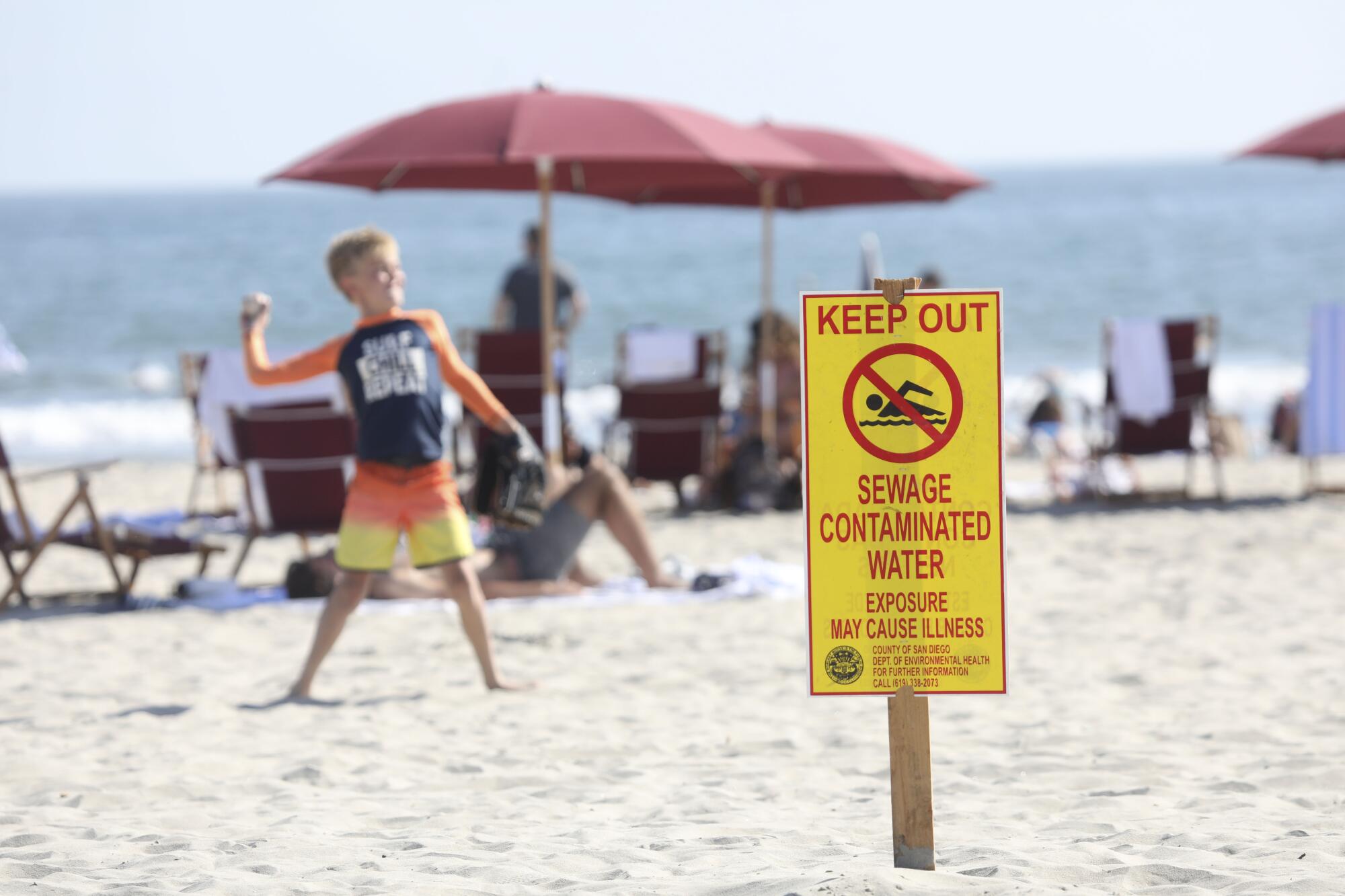 A sewage contamination sign is posted in Coronado on June 29.