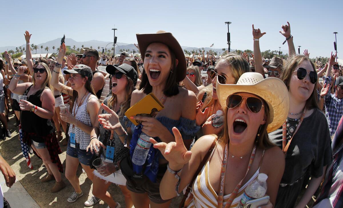 Fans cheer as Morgan Wallen performs.