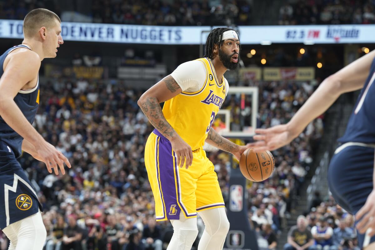 Lakers forward Anthony Davis controls the ball during a loss to the Denver Nuggets on Wednesday.