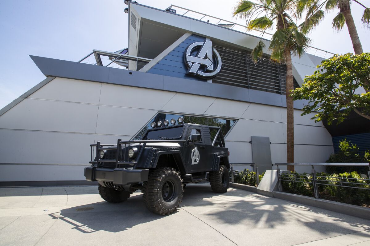 The Avengers Headquarters, Avengers Campus at California Adventure with a black vehicle parked in front