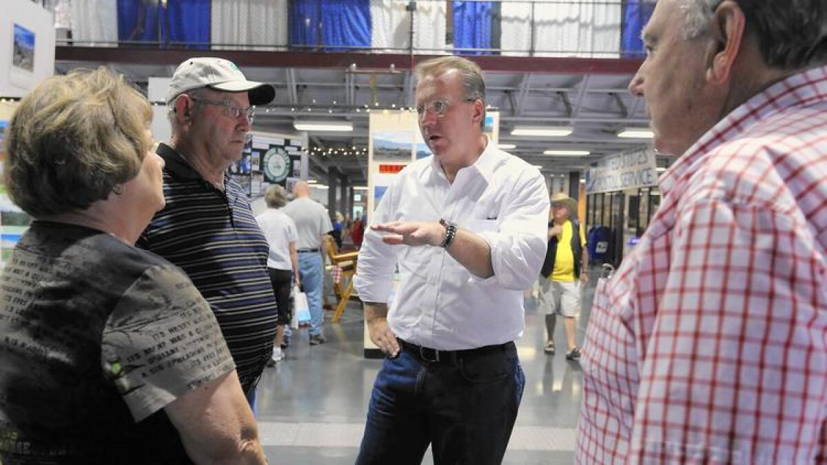 Ron Nehring, a former aide in Sen. Ted Cruz's presidential bid, chats with visitors at the California State Fair in Sacramento during his 2014 campaign for lieutenant governor.