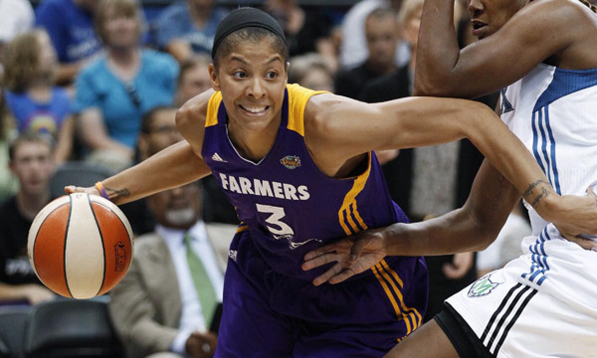 Sparks star Candace Parker drives past Minnesota's Rebekkah Brunson during a game in 2012. The WNBA has taken over control of the Sparks franchise.