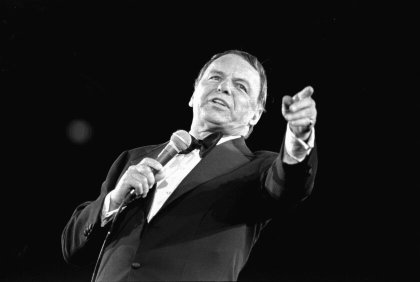 FILE- This April 9, 1974 file photo shows Frank Sinatra performing at the Nassau Veterans Memorial Coliseum, in Uniondale, N.Y. Sinatra's family has teamed up with the Ambassador Theatre Group and movie producer Stewart Till for a stage musical about the man nicknamed the Chairman of the Board. Backers hope it will be ready in 2018. (AP Photo/Richard Drew, File)