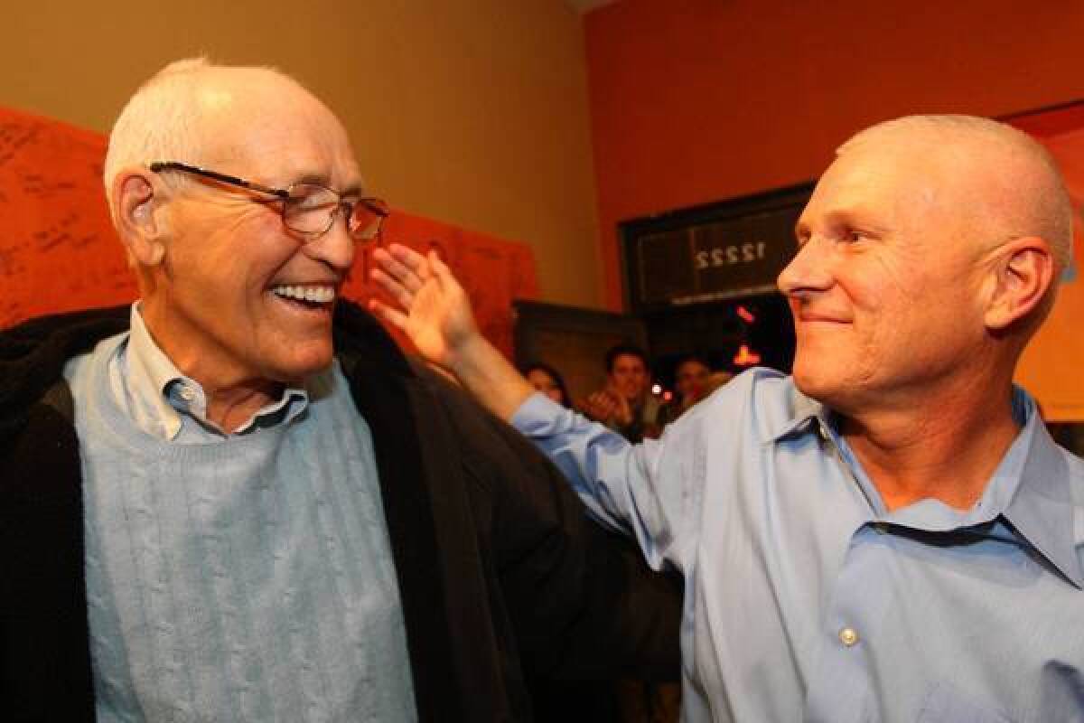 L.A. City Councilman Bill Rosendahl, left, is shown at a Tuesday night election party with his former aide, Mike Bonin, one of the few front-runners for a City Council seat who did not serve in the state Legislature. Bonin aims to replace Rosendahl in the 11th District.