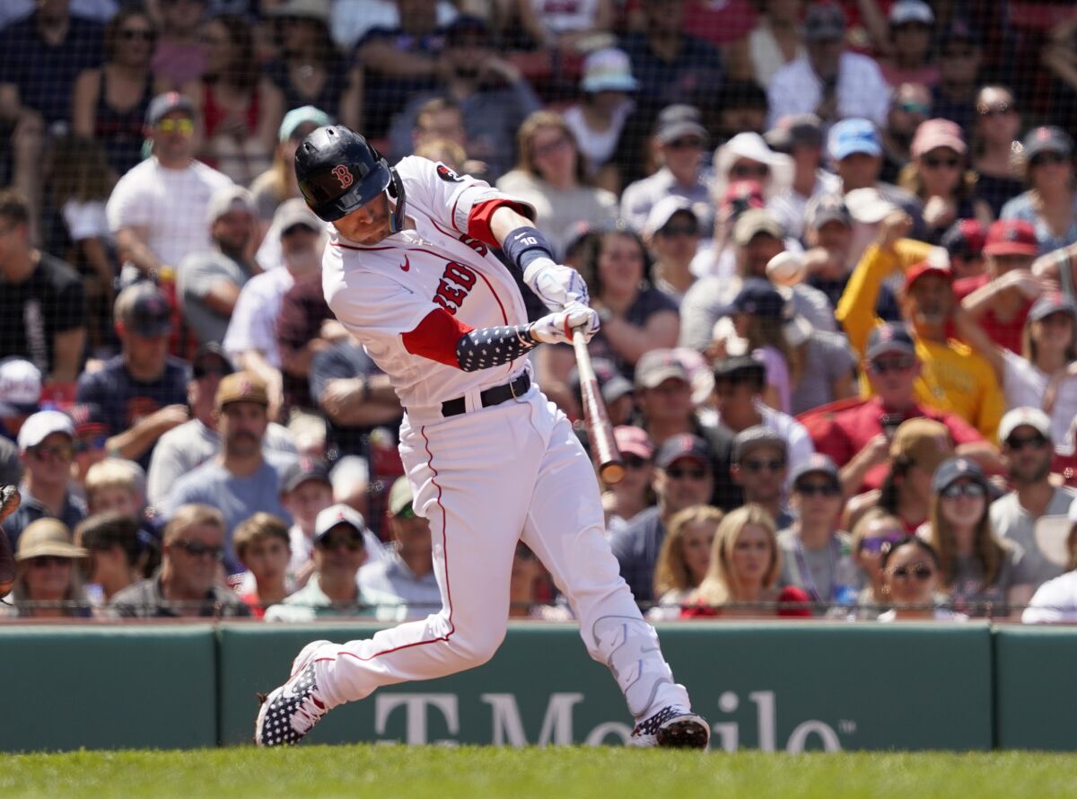 Boston Red Sox's Trevor Story hits a solo homer during the fourth inning of a baseball game against the Tampa Bay Rays at Fenway Park, Monday, July 4, 2022, in Boston. (AP Photo/Mary Schwalm)