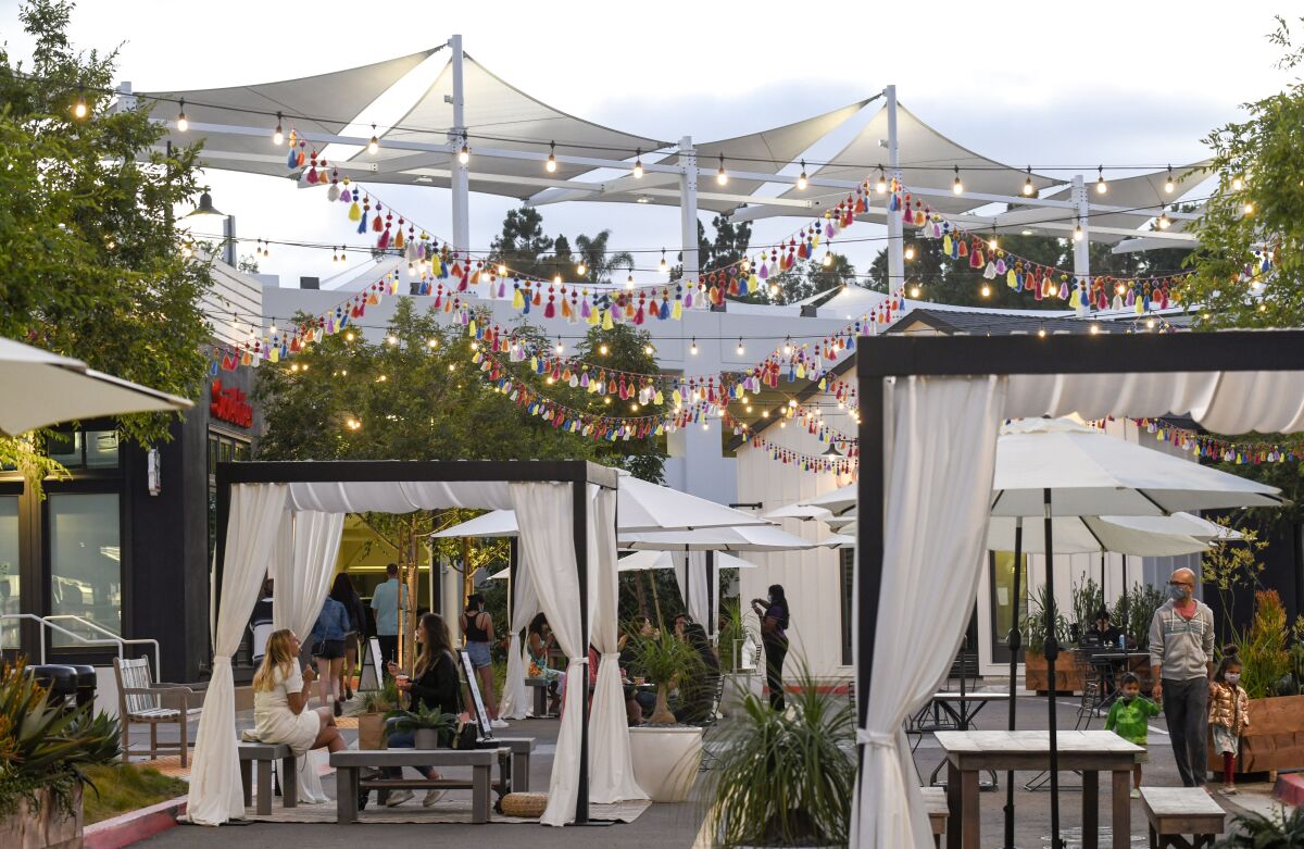 Shoppers and diners enjoy One Paseo Al Fresco Friday, July 24, 2020 in the Carmel Valley area of San Diego.