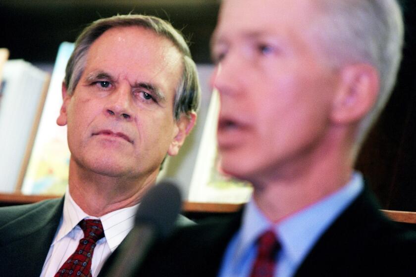 ME.Hart.1130.RG -- Gary K. Hart watches California Governor-elect Gray Davis conduct a press conference announcing him as the State's education secretary, Monday, November 30, 1998 at the LA Library. Photo/Art by:Robert Gauthier