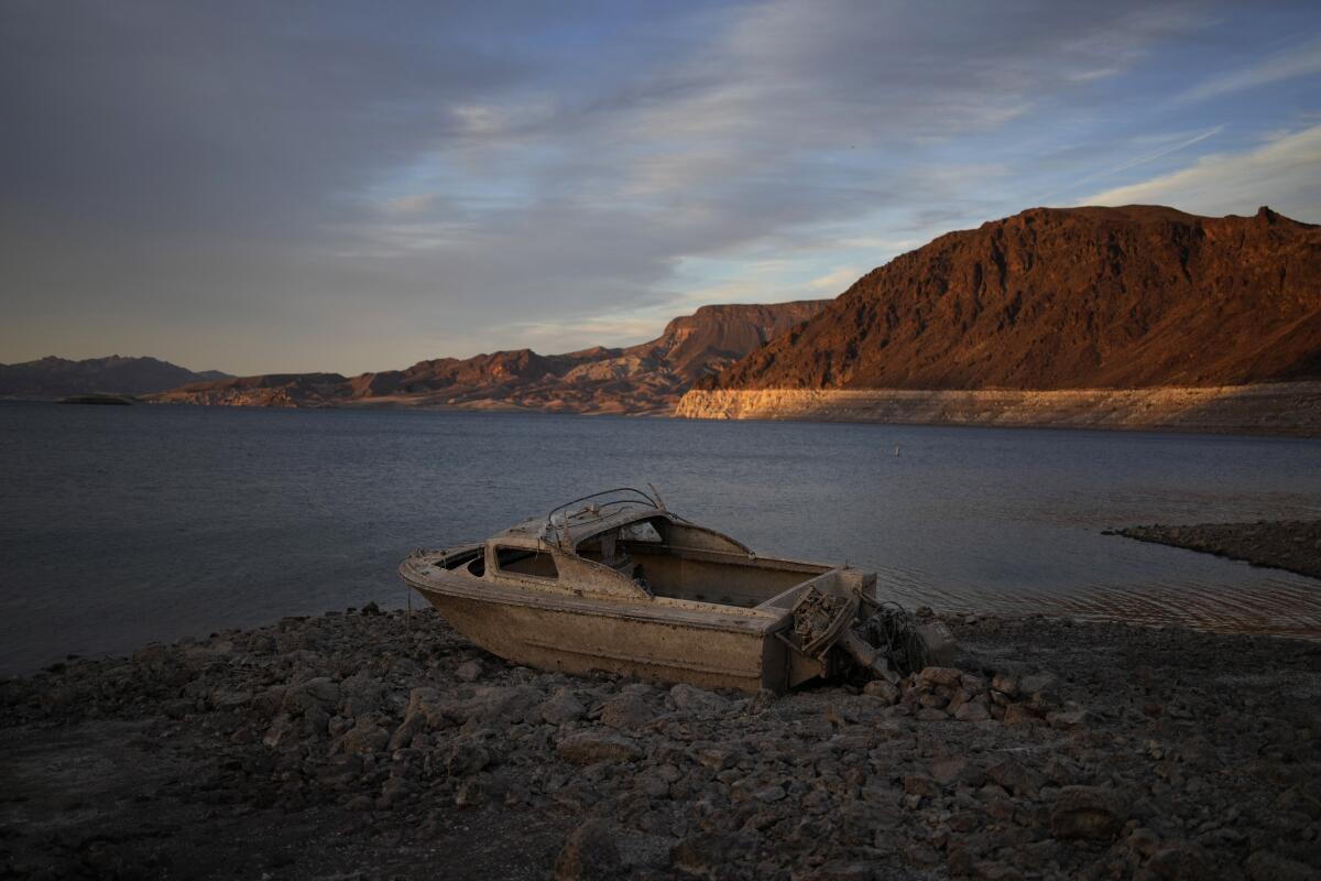 A once-sunken boat sits exposed on the shoreline of Lake Mead at the Lake Mead National Recreation Area, on May 10, 2022