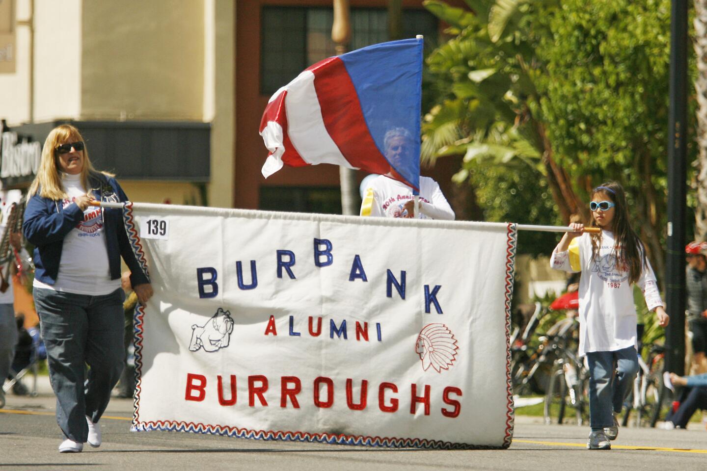 Sharon Stockman, left, Fiona Okida, 9, right, and members of the Burbank and Burroughs Alumni participate in Burbank on Parade, which took place on Olive Ave. between Keystone St. and Lomita St. on Saturday, April 14, 2012.