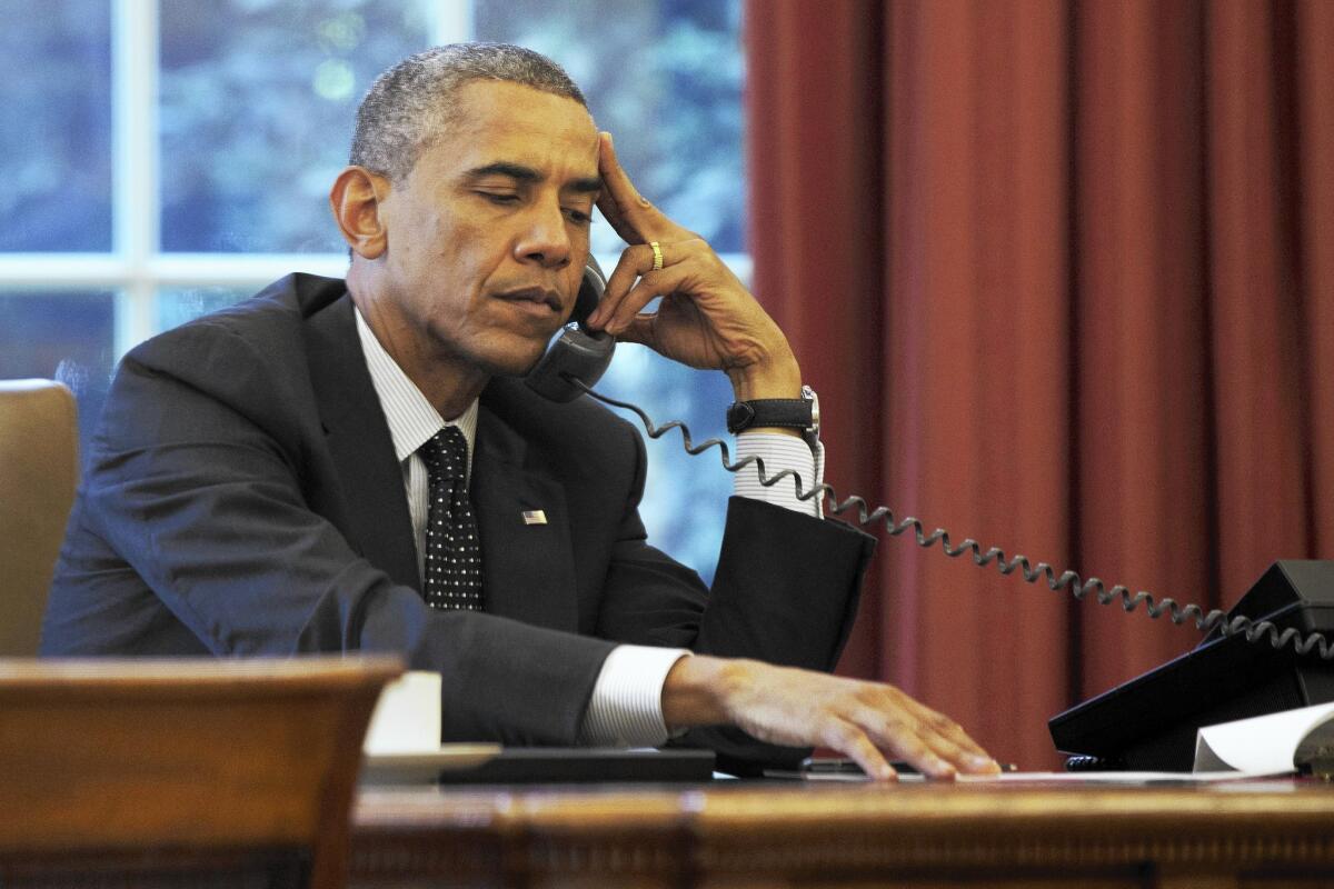 President Obama listens during a phone call at the White house on Friday.